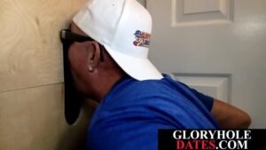 Mature daddy sucks black dick through gloryhole